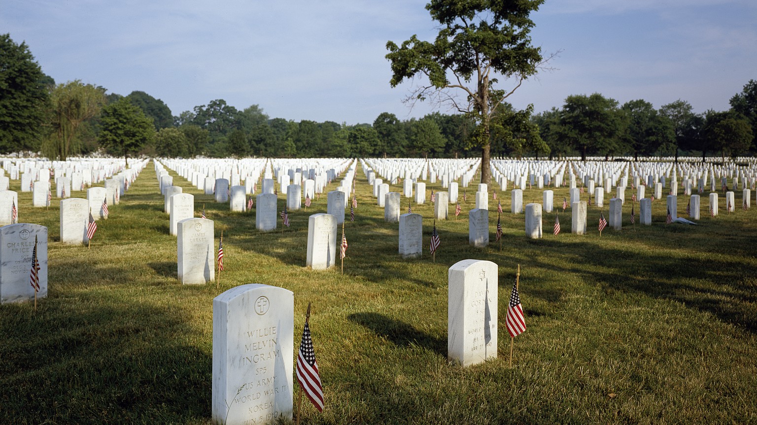 Memorial Day scene with rows of headstones at Arlington National Cemetery in Virginia